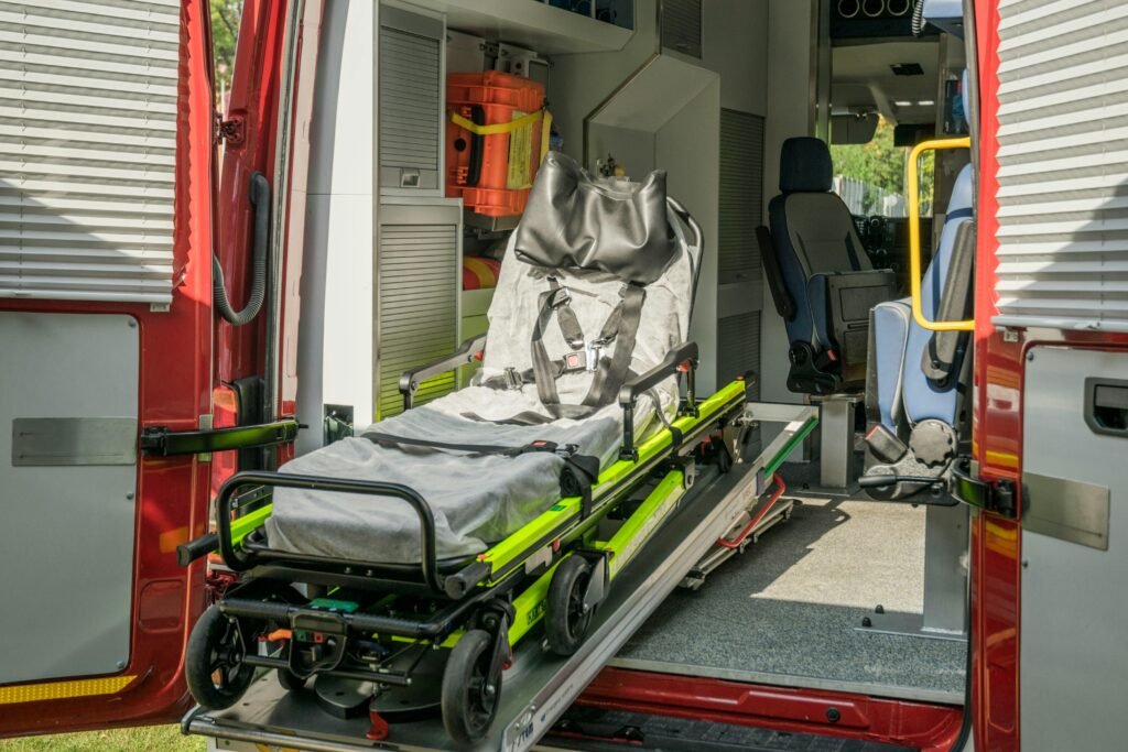 Inside view of a modern emergency ambulance showing a stretcher for patient transport.